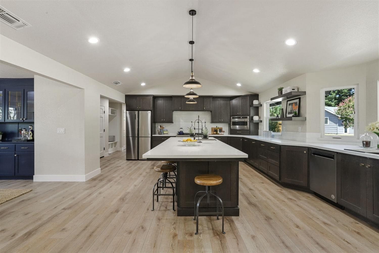 Espresso kitchen island with bar seating and quartz top