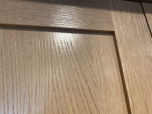 Close-up of rift-sawn white oak shaker cabinet door grain